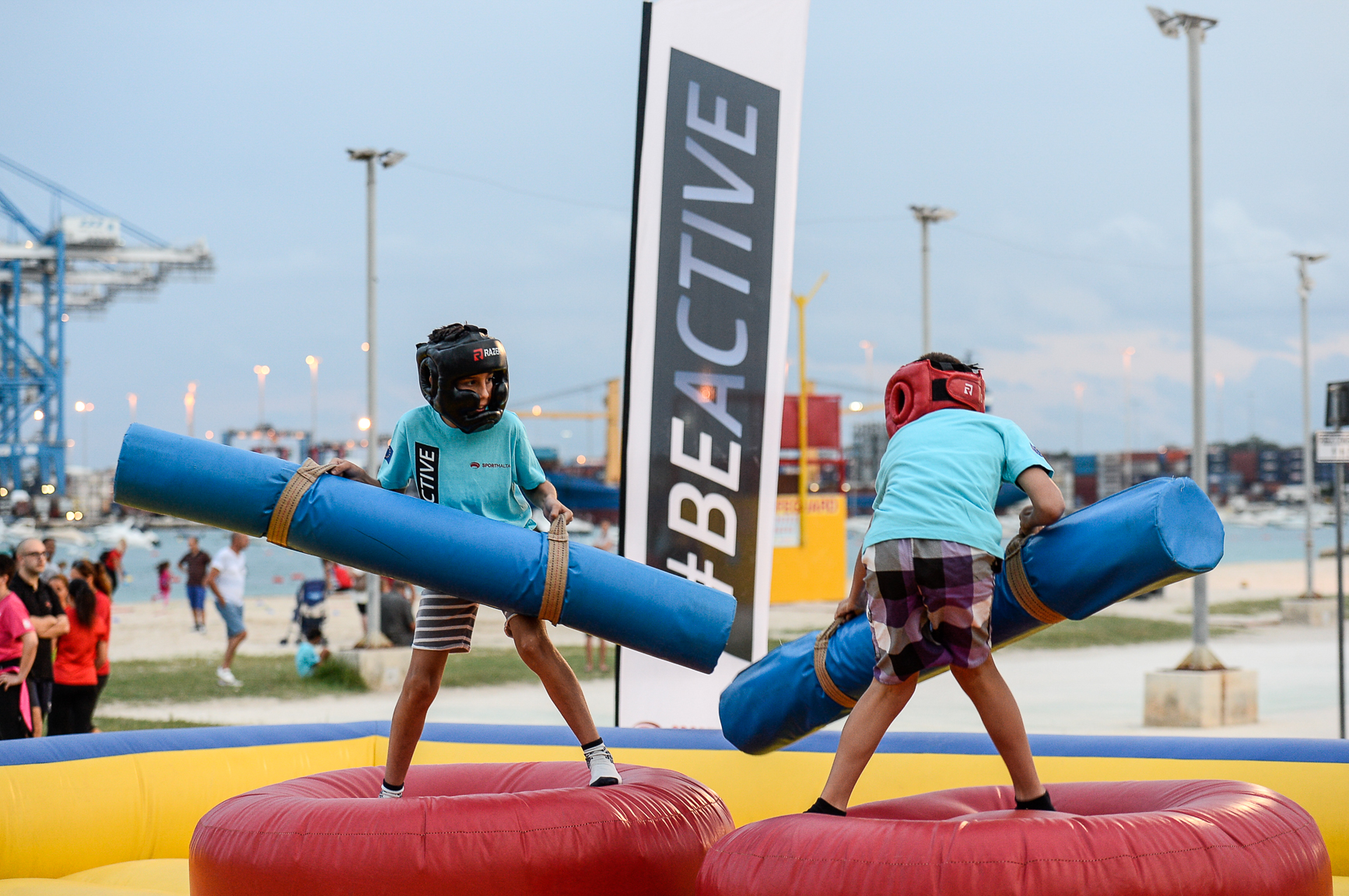 Two children wrestling in Birżebbuga during a Be Active sports event